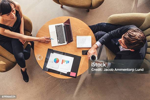 Businesswoman Meeting With Businessman At Office Lobby Stock Photo - Download Image Now