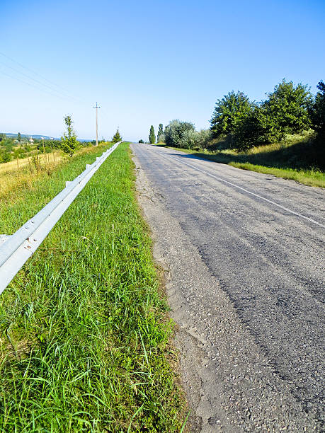 istock Asphalt road and summer landscape 619067186