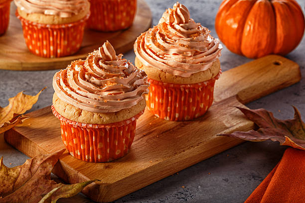 istock Pumpkin cupcakes with glitter sugar sprinkles. 619067414