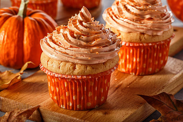 Pumpkin cupcakes with glitter sugar sprinkles.