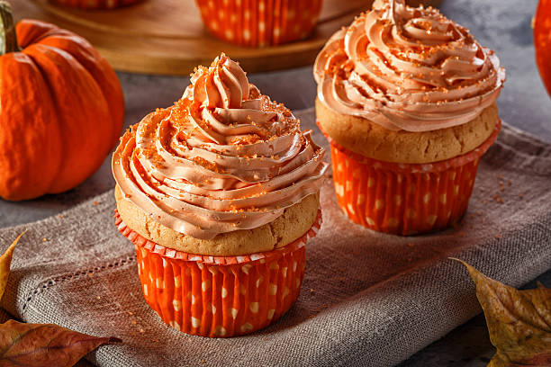 istock Pumpkin cupcakes with glitter sugar sprinkles. 619067556