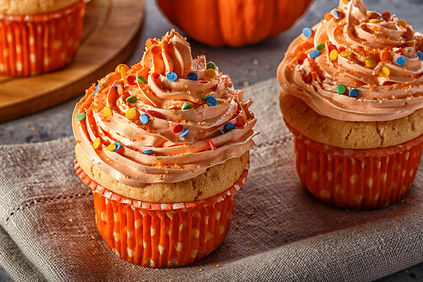 istock Pumpkin cupcakes with glitter sugar sprinkles. 619067730