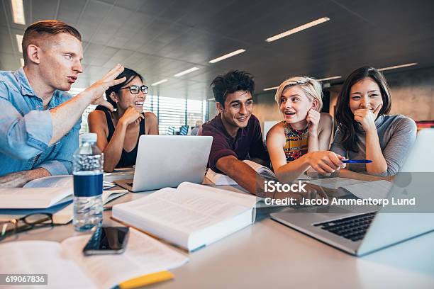 Students Working Together On Academic Project Stock Photo - Download Image Now - University Student, University, Student