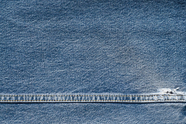 istock .Denim jeans texture or denim jeans background with old torn. 619067916