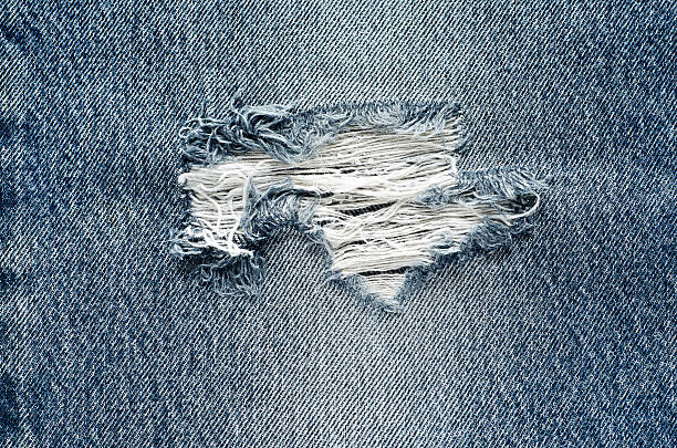 istock .Denim jeans texture or denim jeans background with old torn. 619069344
