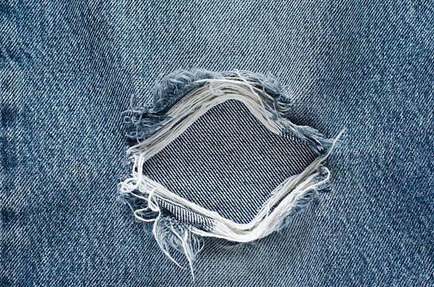 istock .Denim jeans texture or denim jeans background with old torn. 619071354