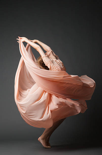 istock Woman dancing in chiffon dress 619072070