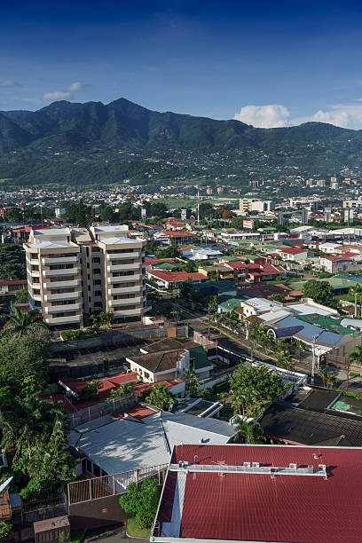 istock Elevated view of cityscape with mountain range in background, Co 619076156