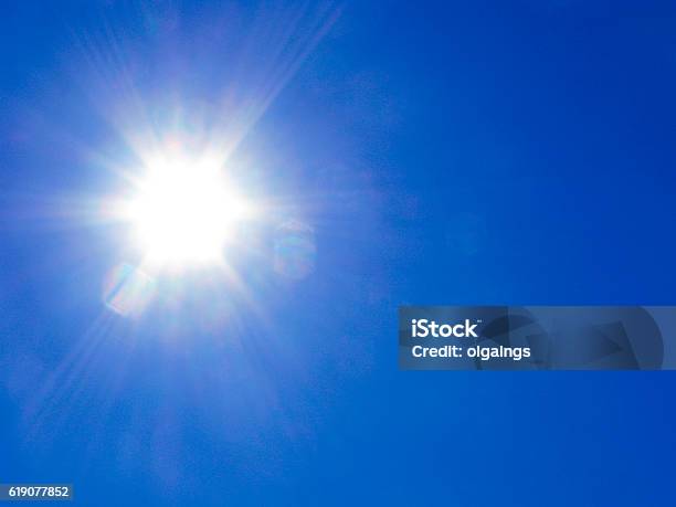 Sun Rays On Blue Sky Stock Photo - Download Image Now - Sun, Sunlight, Solar Flare