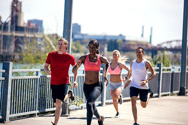 istock Group of diverse athletes sprinting for exercise 619078524