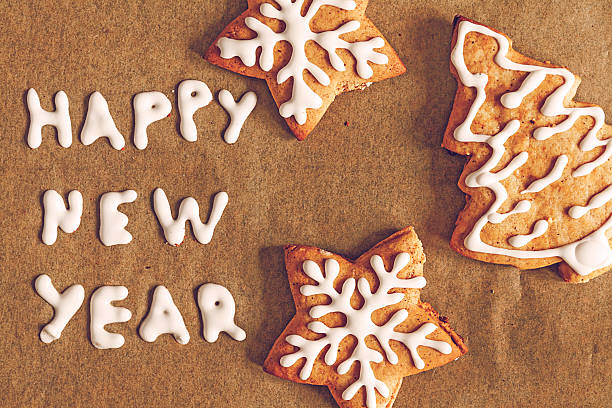 istock Christmas gingerbread cookies and inscription on a dark backgrou 619078550