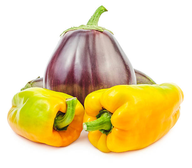 istock Fresh raw eggplant with yellow bellpeppers isolated 619078872
