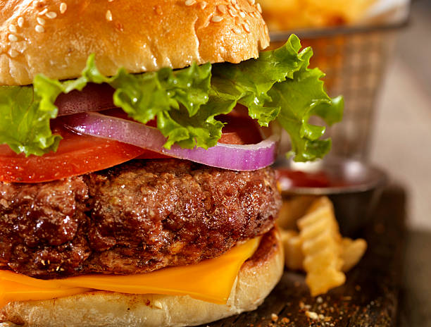 istock Deluxe Cheeseburger with a Basket of Fries 619079380