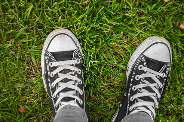 istock gym shoes on a grass 619079788