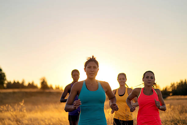 istock Group of diverse female athlete trailrunning as the sun sets 619081188