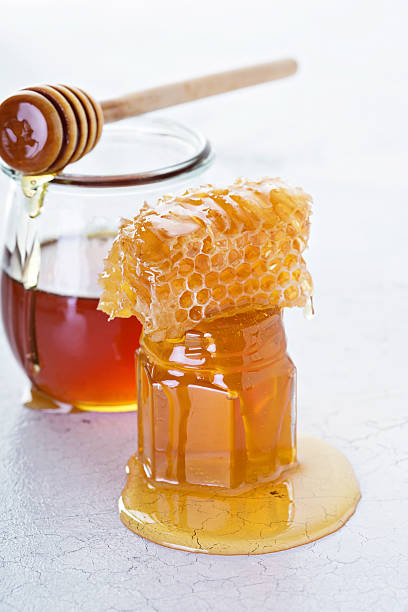 istock Jar of honey and honeycomb 619086680