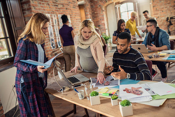 istock Young creatives busy at work in a coworking space 619087726