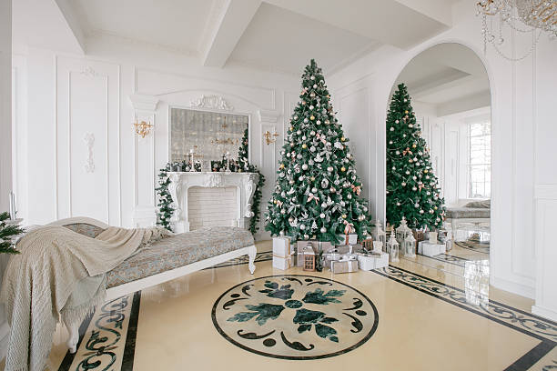 istock Christmas morning. classic luxury apartments with a white fireplace, decorated 619087900