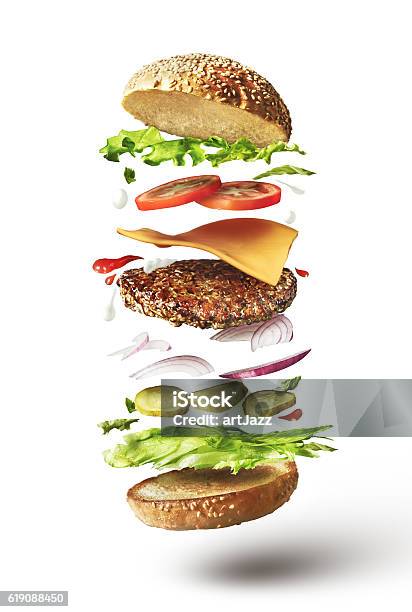 Delicious Hamburger With Flying Ingredients Stock Photo - Download Image Now - Burger, Exploding, Hamburger