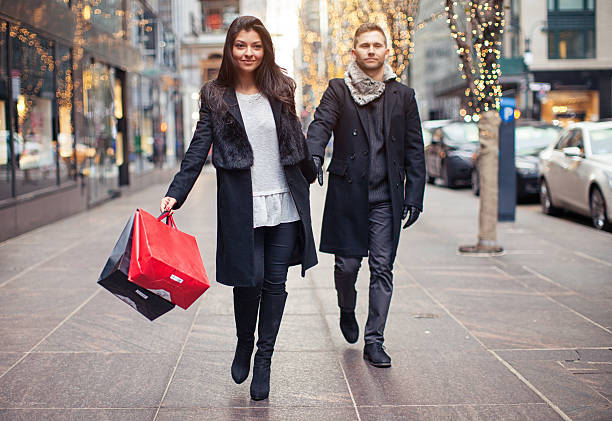 istock Excited woman going shopping with sad husband 619089000