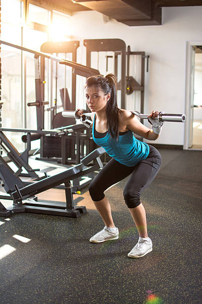 istock Attractive fit woman exercising with weights in gym. 619089222