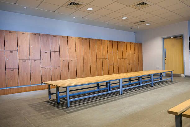 istock Public changing rooms with bench and lockers 619090076