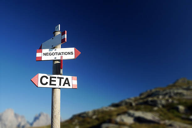 istock CETA negotiations written on mountain trail sign. 619090736