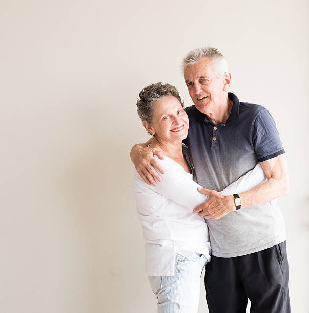 istock Older couple smiling and hugging 619091382