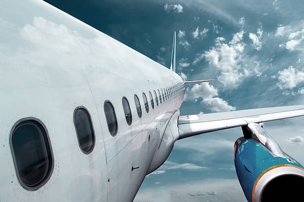 istock Airplane at fly on the sky with clouds 619091550
