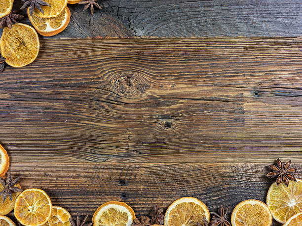istock Dried Orange Slices and Star Aniseed on Wooden Board 619229404