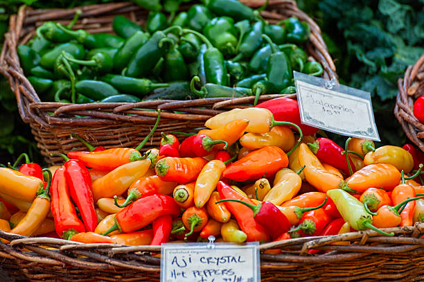 istock Closeup of baskets of peppers 619229440