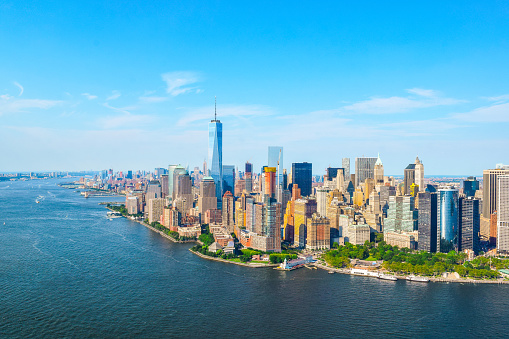 Shot from a helicopter, a view of beautiful Manhattan, New York on a clear blue sky summer day. New York City is a large American City in the State of New York.