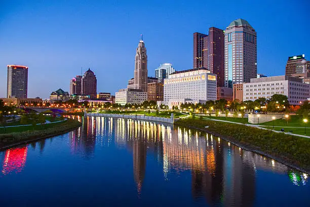 Downtown Columbus, Ohio during beautiful summer sunset. Columbus is the capital of Ohio and largest city of Franklin County. Note: all logos have been blurred in the logo per iStock guidelines for royalty-free submission.