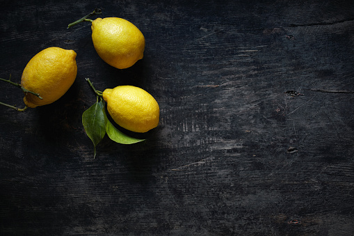 Lemons on wooden surface