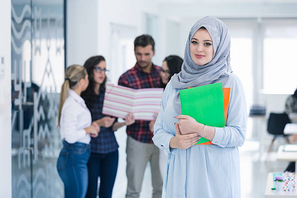 istock Arabic business woman working in team 619233114