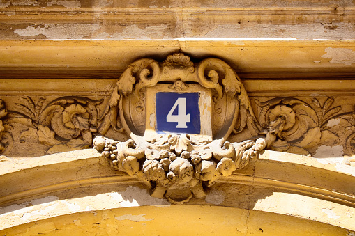 View of building number (4) at the entrance of one of the historical French architecture in Paris
