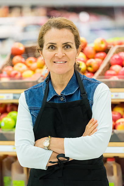 istock Mature female grocery store worker 619233794