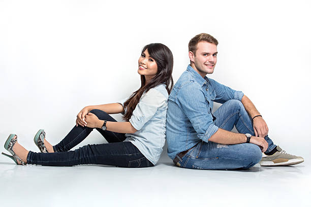 istock Mixed couple sitting on the floor 619234162