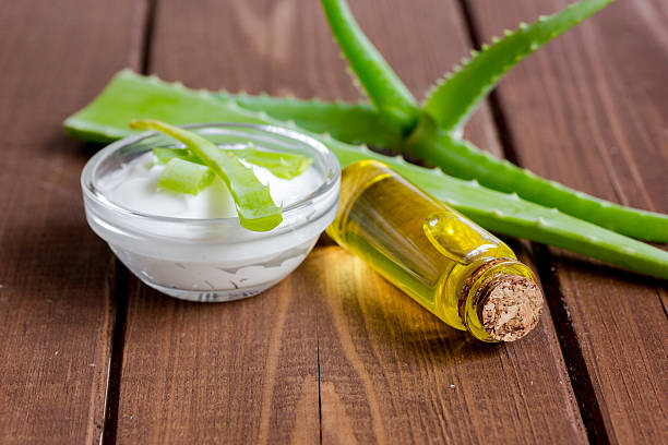 istock cream with added aloe vera on wooden background macro 619235002
