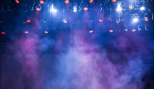 Stage lights and smoke on concert stock photo