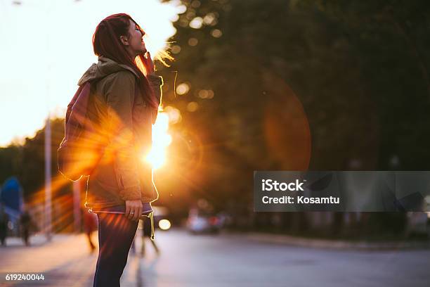 Redheaded Beauty In Sunset Stock Photo - Download Image Now - Winter, Sun, Sunlight
