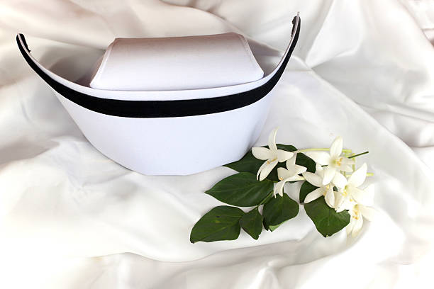istock Nurse hat and Millingtonia flowers 619241032