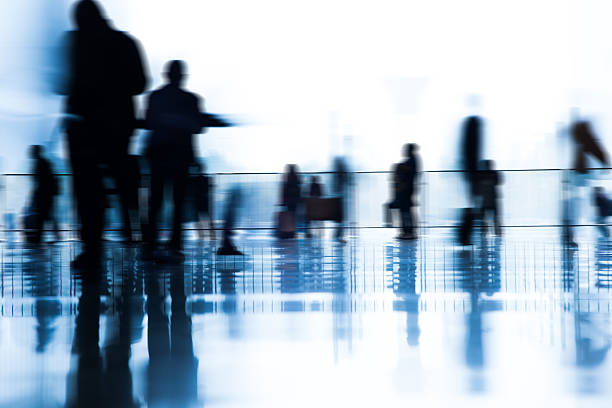 istock people with luggage in airport 619241304