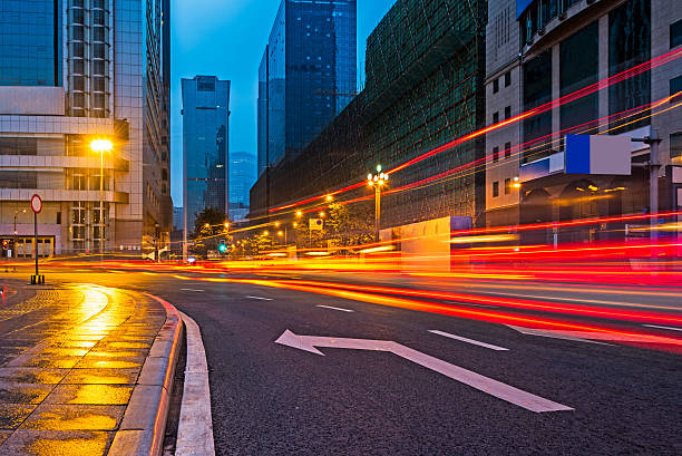 istock traffic light trails on road at night 619241614