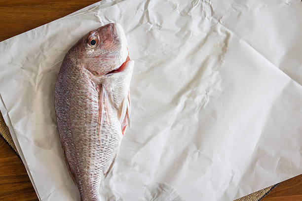 istock Raw fish being prepared for food. 619242020