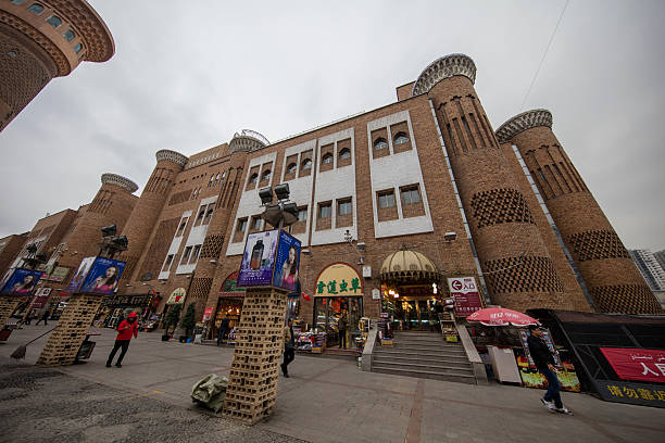 Urumqi, Xinjiang - October 13, 2016: One of the most visually rewarding destinations in Xinjiang’s capital is the Urumqi International Bazaar (also known as the “Grand Bazaar”). Nestled in the heart of Uyghur, Hui and Russian neighborhoods, it claims to be the largest bazaar in the world. A lot tourists are in the Bazaar.