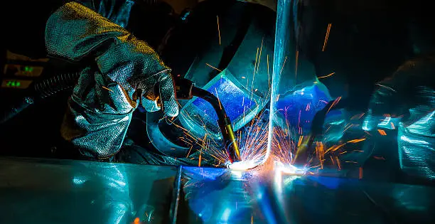 Photo of Industrial steel welder in factory