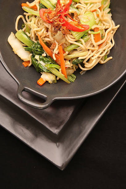 istock Lunch time - stir fry vegetable with noodles 619244284