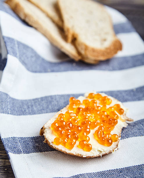 istock Sandwich with butter and red salmon caviar 619246258
