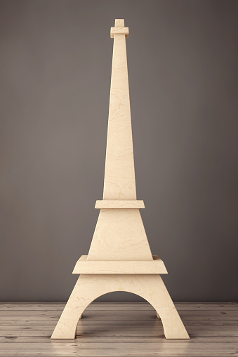 Wooden Eiffel Tower Statue on a wooden table. 3d Rendering